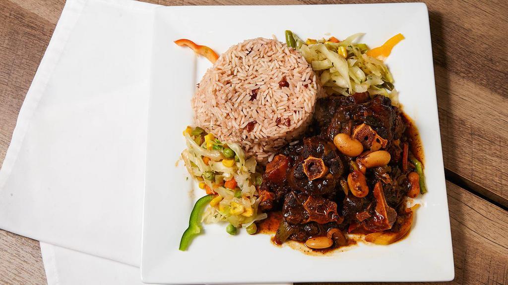 Oxtails · Fall off the bone juicy tender meat that is marinated and slowed cooked to perfection.