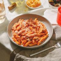 Penne Alla Vodka · Penne pasta coated in a delicious, creamy vodka sauce, and topped with fresh Parmesan cheese.