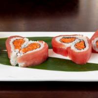 Passion Roll · Spicy crunchy tuna, salmon, yellowtail & crab stick with tuna wrapped around the outside mak...