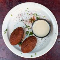 2-Piece Kibbeh Balls · Fried balls of burgoul with pine nuts, peppers and ground meat.