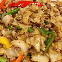 Pad Kee Mao · Stir fried flat rice noodle with your choice of ground meat, green bean, bell pepper, Thai c...