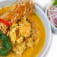 Khao Soi · Northern Thai curry Served with egg noodle and your choice of meat and a side of bean sprout...