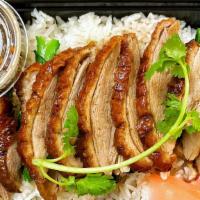 Roasted Duck Over Rice · Sliced boneless roasted duck and yu choy Topped with Thai style duck sauce