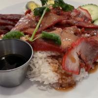 Khao Moo Daeng · B.B.Q. Pork, Chinese sausage and boiled egg Served with steamed rice Topped with cilantro, c...