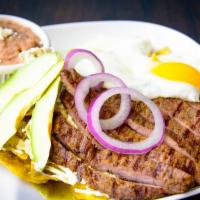 Cajun Steak Chilaquile · Bistec Enchilado.