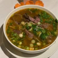 Grilled Beef Pho · Fettuccine rice noodle soup with sliced beef, snow pea, onion, broccoli, carrot cilantro, ba...