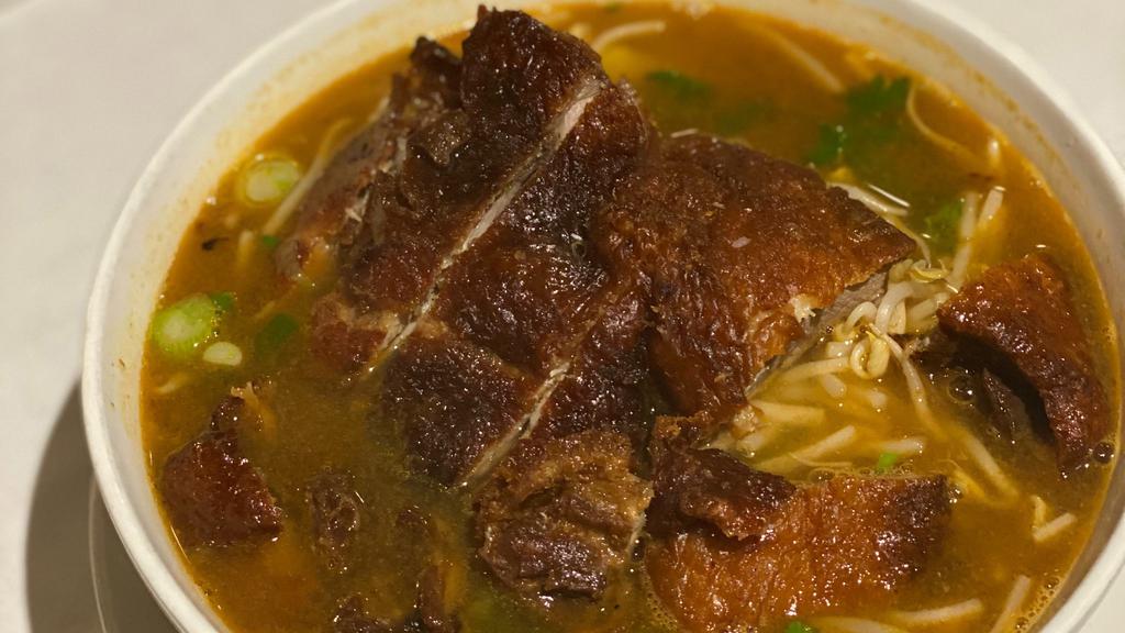 Ba Mee Ped · Thin egg noodle soup with crispy duck in five spices broth.