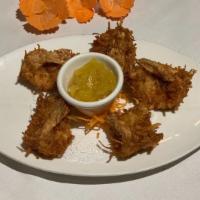 Coconut Shrimp (6) · Crispy shrimp coated with a sweet coconut batter. Served with Thai sweet chili sauce.