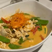 Panang Curry · Coconut milk, red bell peppers, string beans, kaffir leaves and peanut. Hot and spicy.