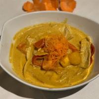 Mango Curry · Red curry paste with a bell, green bean, mango, tomato, and coconut milk.