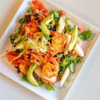 Shrimp And Avocado Salad · Shrimp over mixed greens and tomatoes.