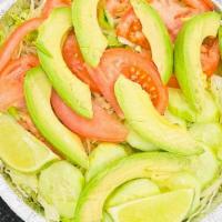 Mini Lettuce, Tomato And Avocado Salad · Fresh shredded lettuce and tomatoes and watereed cucumber slices topped with sliced avocado....