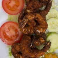 Breaded Shrimp · Adobo Shrimp Breaded & deep-fried.
Served with rice and beans, green plantain, sweet plantai...