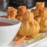 Crab Rangoon · Crab meat and cream cheese wrapped in wonton wrapper.