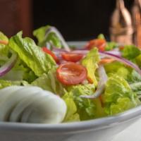 Thai Salad · Fresh green salad, tomato, egg, red onion and peanut sauce dressing.