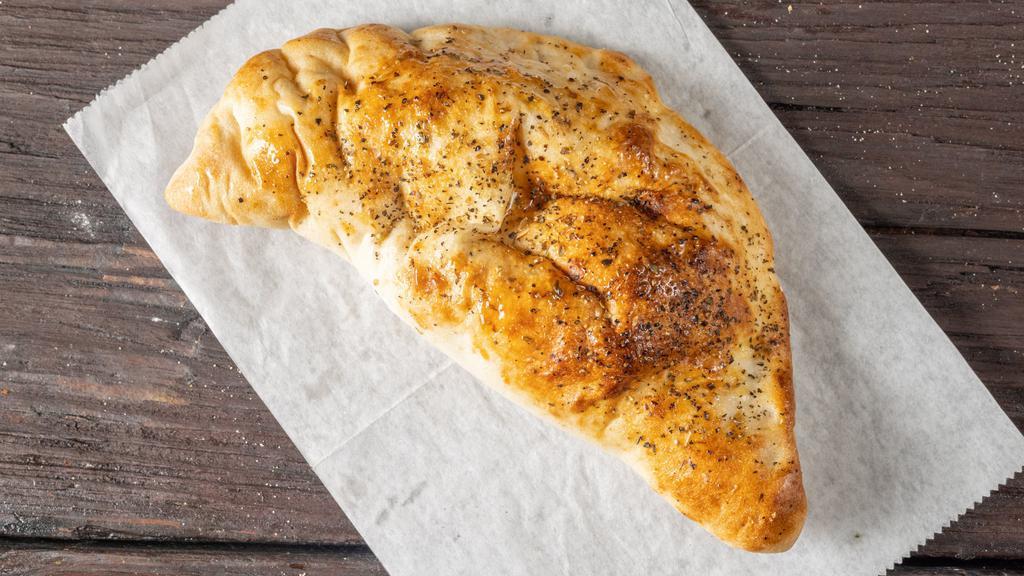 Cheese Calzone · Stuffed folded pizza pocket with cheese.