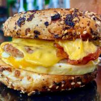 The W.I.H. · An everything bagel with two eggs, two slices of American cheese, bacon, sausage, and bourbo...