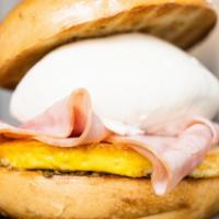 The C.T.T.R. · A toasted rosemary bagel with egg, ham, fresh burrata, pesto