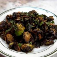 Brussel Sprouts · Deep fried Brussels sprout with scallions, chopped mint and tossed in a lemon vinaigrette. -...