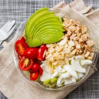 California Chopped Salad · Iceberg lettuce, egg whites, avocado, grilled chicken, tomato and almonds. Served with balsa...