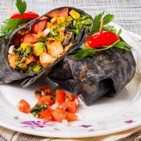 Chicken Veracruz Wrap · Made with grilled chicken, avocado, black beans, corn salad, and lettuce. Served in a black ...