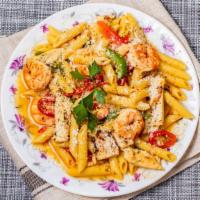 Penne Alla Bahia · Penne pasta, shrimp, grilled chicken, tri-color peppers, fresh tomato, and roasted garlic.