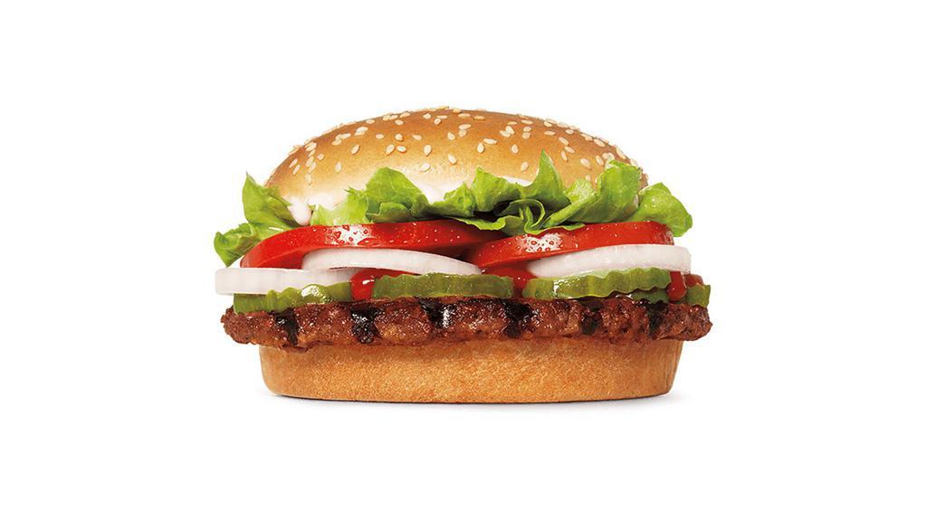Impossible™ Whopper® · Our Impossible™ WHOPPER® Sandwich features a savory flame-grilled patty made from plants topped with juicy tomatoes, fresh lettuce, creamy mayonnaise, ketchup, crunchy pickles, and sliced white onions on a soft sesame seed bun. 100% WHOPPER®, 0% Beef