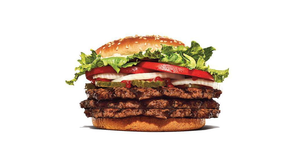 Triple Whopper · Our Triple Whopper Sandwich includes three 1/4 lb* savory flame-grilled beef patties topped with juicy tomatoes, fresh lettuce, creamy mayonnaise, ketchup, crunchy pickles, and sliced white onions on a soft sesame seed bun.