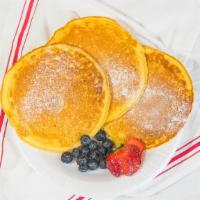 Pancakes · Three jumbo pancakes with maple syrup.