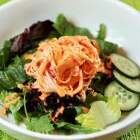 Kani Salad · Crabmeat and cucumber mixed with spicy mayonnaise on top.