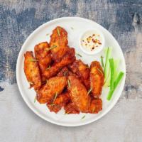 Classic Chicken Wings · Fresh chicken wings breaded and fried until golden brown. Served with a side of ranch or ble...