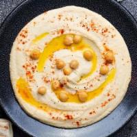 Hummus · Gluten-free. Vegetarian. Pureed chickpeas, tahini, yogurt and garlic.