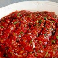 Acili Ezme · Gluten-free. Vegetarian. Spicy red pepper dip with coarsely chopped walnuts, onions, hot pep...