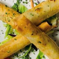 Sigara Boregi · (Cheese rolls). Yufka pastry sheets stuffed with feta and parsley, rolled into cigar shape a...