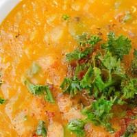 Lentil Soup · Gluten-free. Vegetarian. Red lentils cooked with vegetables and herbs.