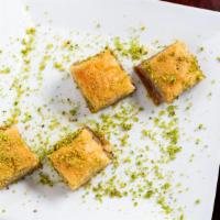 Baklava · Layers of buttered yufka filled with crushed walnuts and served in syrup.