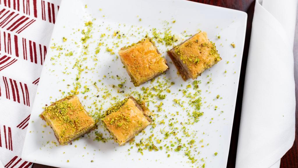 Baklava · Layers of buttered yufka filled with crushed walnuts and served in syrup.