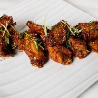 Sambal Wings · Sweet sambal celek sauce, scallion, sesame seeds