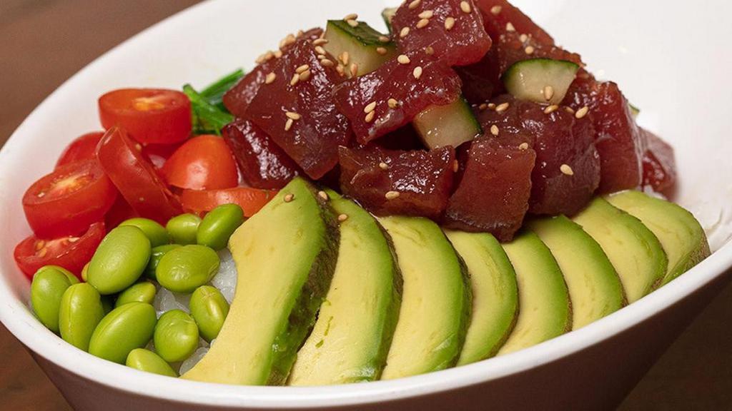 Ahi Tuna Poke Bowl  · Ahi Tuna served with cucumber and green onions mixed in poke sauce. Enhanced with grape tomatoes, avocados, edamame and seaweed salad; topped with sesame seeds .