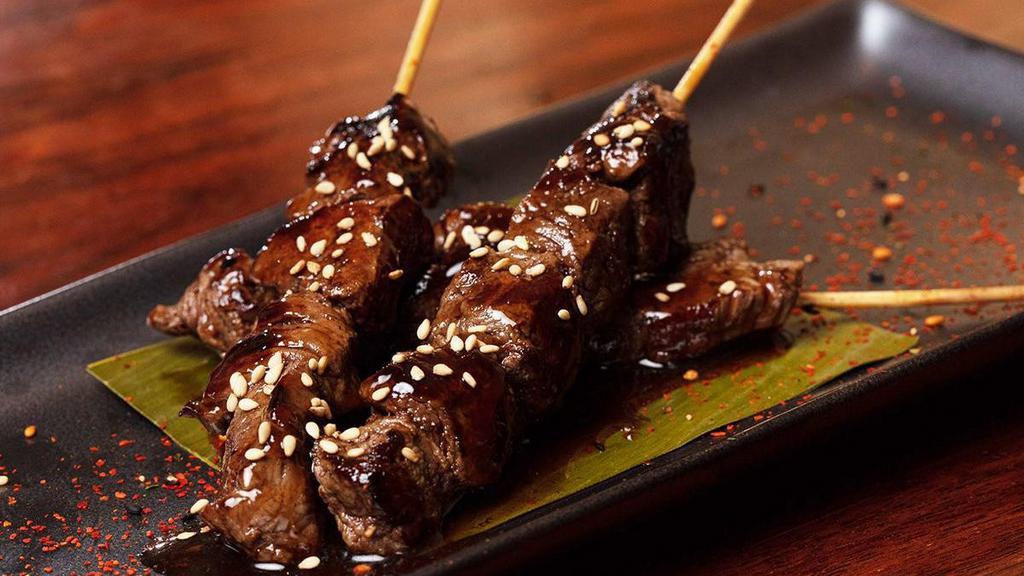 Filet Mignon Skewers · Three skewers of seared filet mignon cooked in sake teriyaki sauce; topped with sesame seeds and togarashi. .