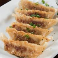 Pork Gyoza · Sauteed Asian potstickers served with ponzu sauce