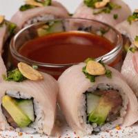 Chili Ponzu Yellowtail Roll · Spicy yellowtail mix rolled with cucumber, avocado, jalapeños and cilantro; topped with yell...