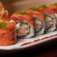 Gojira Roll · Shrimp tempura, krab† mix, cream cheese and cucumber rolled and topped with spicy tuna and g...
