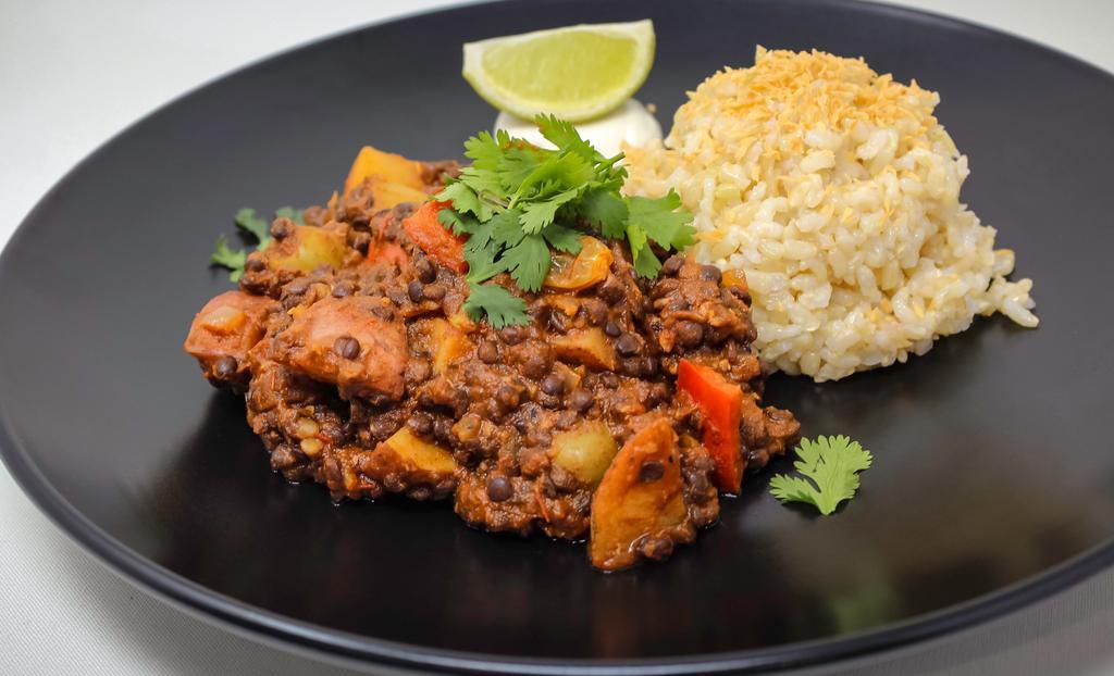 Lentil Picadillo · Contains nuts. Black lentil picadillo, red potato, green olives, raisins, tomato, cilantro, sour cream, lime, served with coconut brown rice *contains nuts. *Please let us know if you have any allergies.