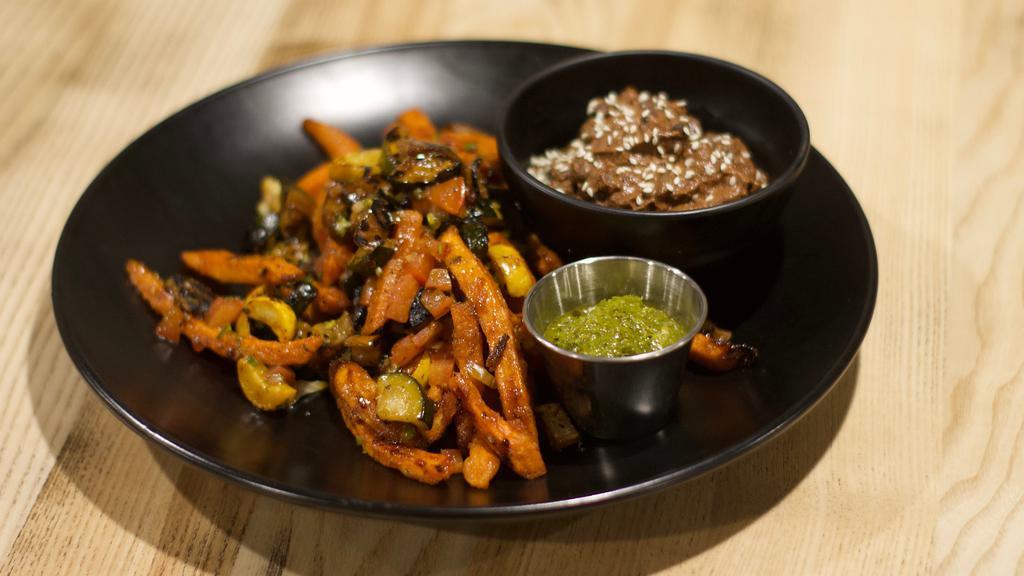 Lomo Saltado · Charred zucchini and eggplant, sweet potato fries, lomo sauce, pico de gallo, chimichurri, cilantro, served with miso mole black beans *contains soy and sesame. *Please let us know if you have any allergies.
