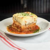 Moussaka · Layers of chopped sirloin, eggplant, and potatoes topped with bechamel.