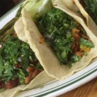Tacos · Comes with lettuce, tomato, onions, cilantro, and any type of meat