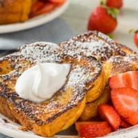 Strawberry Cream Cheese French Toast (3 Slices) · 3 slices of french toast with strawberry cream cheese and topped with fresh strawberries