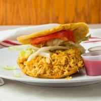 Patacon Plantain Sandwich (Chicken) · Fried plantain filled with chicken, cheese, lettuce, tomatoes and special house sauce.