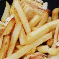 Dominican Club Sandwich · Served with fries and soda.